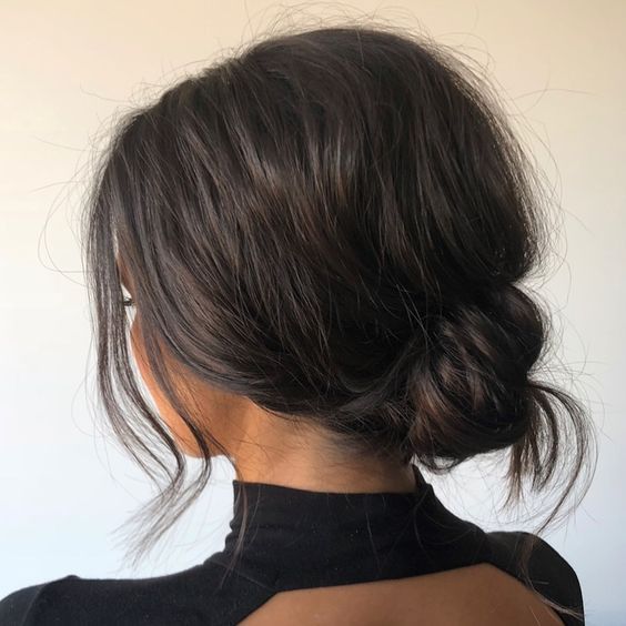 a relaxed and messy low bun with a bump on top and some locks down will fit a relaxed or casual bridesmaid look