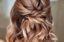 21 an amazing half updo with a twisted top, a twisted knot and waves down is a cool idea for a boho look