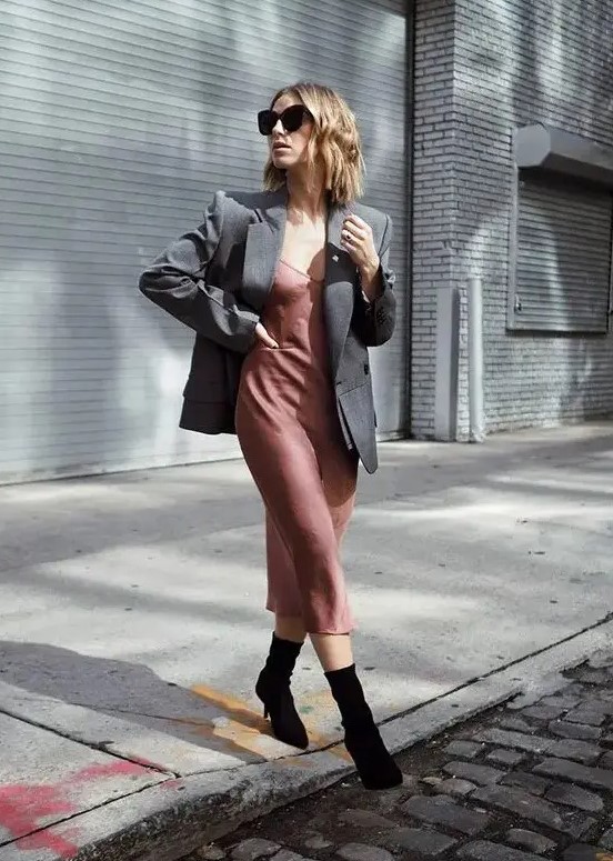 a mauve slip midi dress, a grey oversized blazer, black sock boots for a relaxed and minimal guest outfit