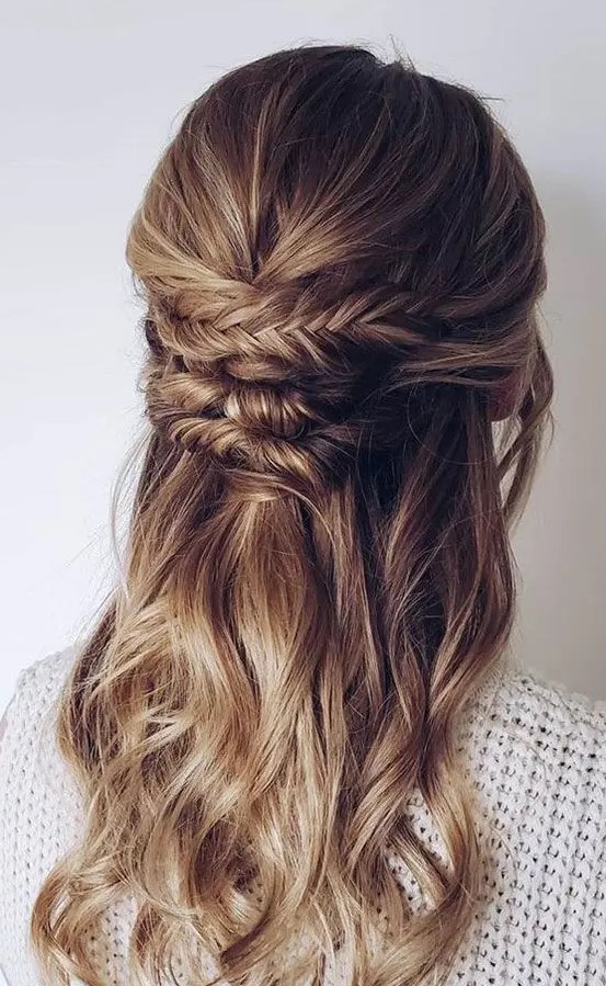 a beautiful boho half updo with a textured top and a braided and twisted element plus waves down is a cool idea