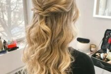 32 a beautiful golden blonde wavy half updo with a bump on top and some twists is a cool idea for a wedding