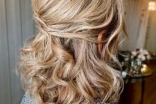 36 a beautiful and timeless half updo with a bump on top and waves down is a stylish idea for medium hair