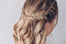 36 a boho wedding half updo on medium hair, with a large fishtail braid on one side and waves down is a stylish solution