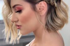 37 a catchy and stylish half updo with a loose braid on one side and waves down is a lovely solution for a boho or rustic wedding