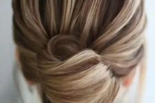 37 a chic and elegant French twist updo with a voluminous top and an elegant knot will fit medium length hair, too