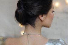 39 a chic mother of the bride updo with a bump on top and several volumes twisted is a beautiful and comfy to wear hairstyle