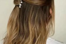 39 a lovely half updo with a bump on top and a twist accented with pearl hair pins is good for medium and long hair