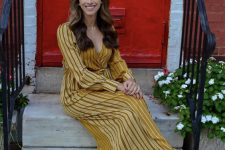 40 a yellow striped maxi dress with a V-neckline, nude shoes and layered necklaces are a lovely combo for a wedding