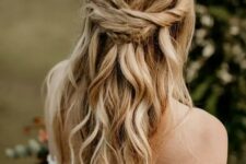 41 a boho half updo with a twisted and braided touch and waves down will fit a bride or a bridesmaid
