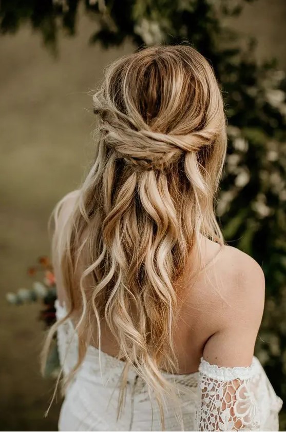 a boho half updo with a twisted and braided touch and waves down will fit a bride or a bridesmaid