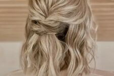41 a simple and cool half updo with a bump on top, a twisted element and waves down is a cool idea to rock