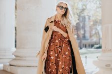 41 an elegant fall wedding guest look with a brown printed midi dress, burgundy velvet boots, a beige coat and a neutral bag