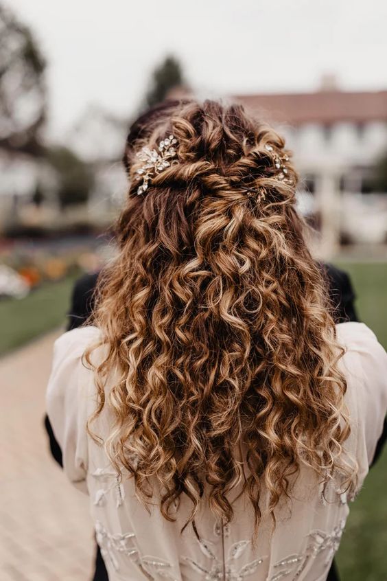 a beautiful curly half updo with twists, rhinestone hairpieces and curls down is a great idea for a big day