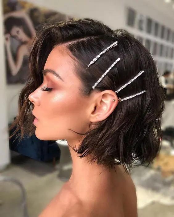 a messy wavy bob with side parting can be accented with rhinestone hairpins, you don't need anything else for a cool look