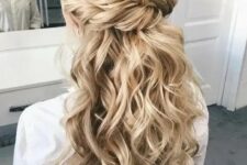 47 a chic wedding hairstyle with a twisted voluminous top, twisted braids and waves down is great for long hair