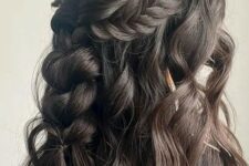 49 a cool boho half updo with a wavy bump, a braided halo and a losse braid down plus some waves