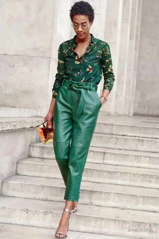 a dark green floral shirt, emerald leather pants, silver shoes and a bold clutch are a lovely look for a fall wedding