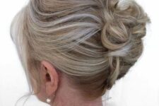 52 a stylish updo on medium hair, with a bump on top and waves, face-framing locks is a cool idea