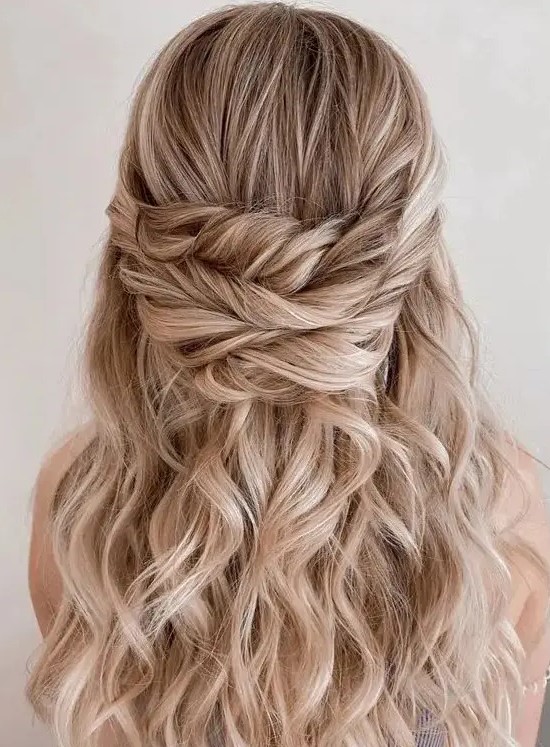 a gorgeous wavy and textured triple twisted wedding half updo is amazing for weddings, it's perfect for long hair
