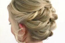 54 a twisted updo with a bump on top and a lot of volume, with face-framing locks is a cool solution for a mother of the bride