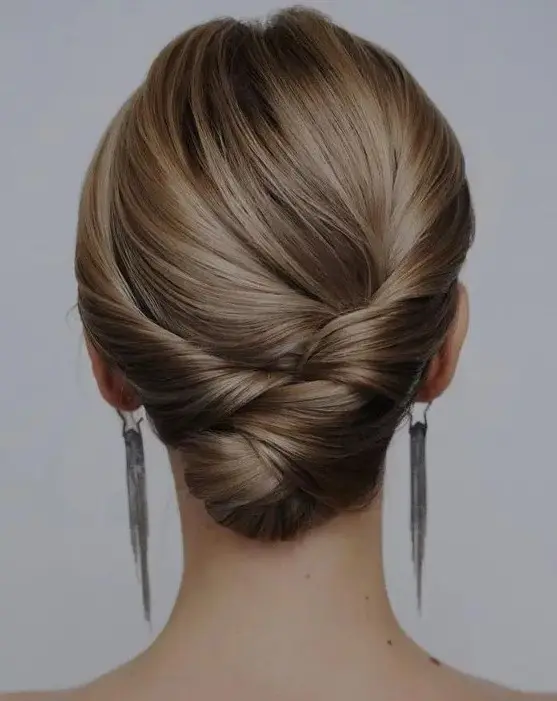 an elegant and chic twisted and braided low updo with a sleek top is always a good idea if your hair is long enough