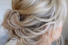 56 an elegant and relaxed updo on medium hair, with waves, a bump on top and waves framing the face is chic