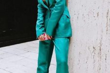 59 an emerald pantsuit with a long blazer, pants, pink shoes and statement earrings is a catchy look to rock