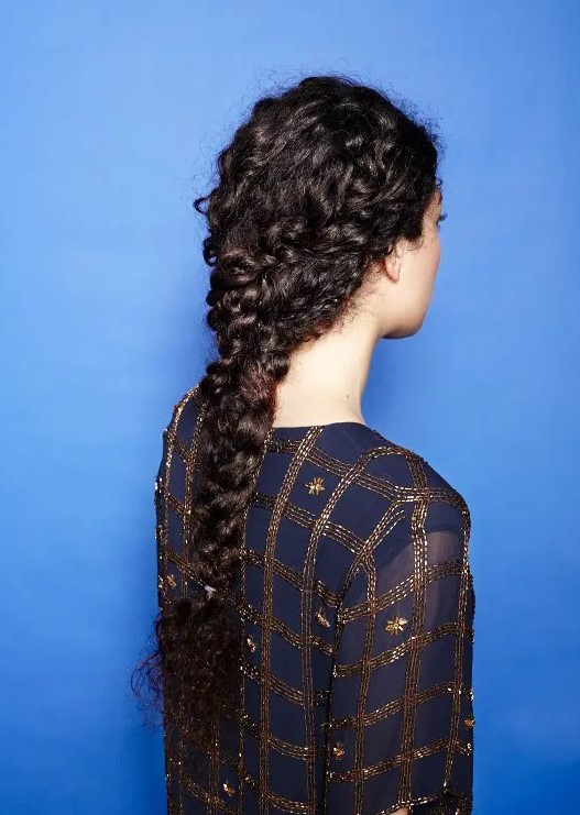 a curly long braids coming into a single braid is a whimsy and very boho chic idea