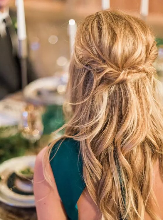a messy twisted wavy half updo on long hair is a great relaxed idea that is suitable not only for a bridesmaid