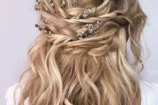 70 a pretty wavy twisted half updo with waves, fresh blooms and waves down and a bump is a cool rustic or boho solution