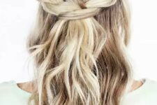 73 a simple boho or rustic wedding half updo with a braided halo, waves down is a cool idea for relaxed bridal styles