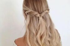 74 a twisted half updo with an accent braid and waves for a relaxed wedding