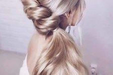a beautiful and delicate braid going into a side ponytail, with a volume on top is a lovely idea for a romantic bride