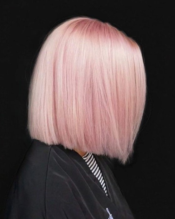 a beautiful and lovely light pink straight long bob with shiny and chic hair is amazing to make a statement