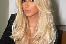 a beautiful golden blonde butterfly haircut on long and thick hair, with a lot of volume is a lovely idea