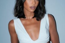 a beautiful long black bob with waves and middle part is a stylish and elegant idea, and that shiny finish adds to the look