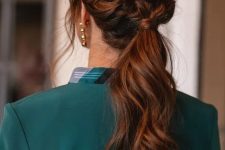 a beautiful low ponytail with a braided halo and some face-framing locks is a cool idea for a modern or boho bridesmaid