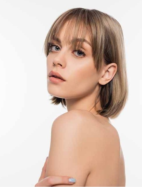 a beautiful mousy brown and bronde long bob with wispy and side bangs that beautifully frame the face