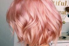 a beautiful pastel pink shaggy midi bob with waves and a shiny finish is a catchy and cool idea