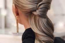 a beautiful twisted and wavy ow ponytail with a volume on top is an amazing and stylish bridesmaid hairstyle