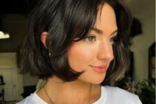 a black chin-length bob with side bangs and waves is a catchy idea for any type of hair, and such bangs fit most face shapes