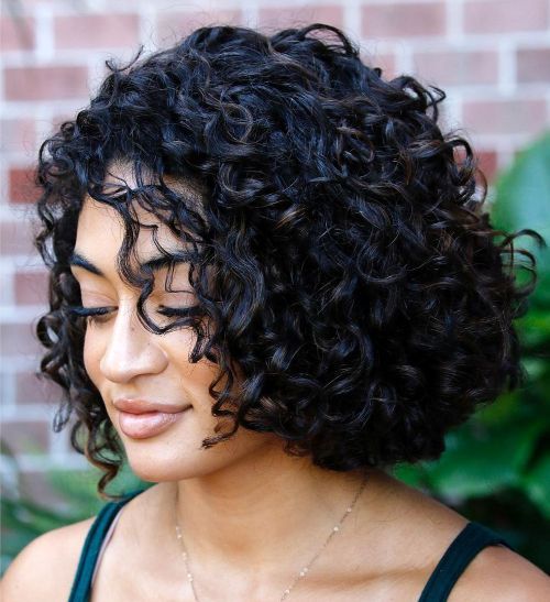 a black curly bob with a lot of natural volume is a catchy and stylish idea, embrace your natural hair texture