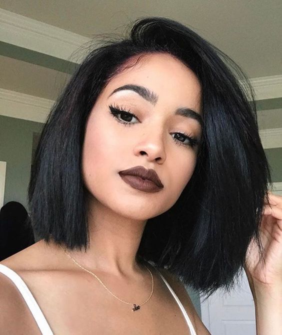 a black voluminous bob with side parting is a stylish way to show off your thick hair
