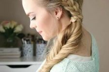 a boho side swept hairstyle of a braid coming down is a stylish idea for a boho or rustic bride