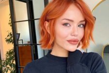 a bold copper red chin-length bob with a bit of waves is a stylish idea that will catch an eye with color
