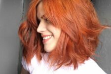 a bold red shaggy long bob with a bit of waves and a lot of dimension is a cool and catchy idea