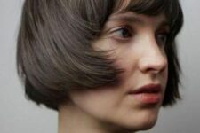 a brunette ear-length bob with a classic fringe and curved ends is a lovely idea