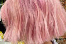 a bubblegum pink midi textural bob with a lot of volume and a bit of waves is a catchy and bright idea