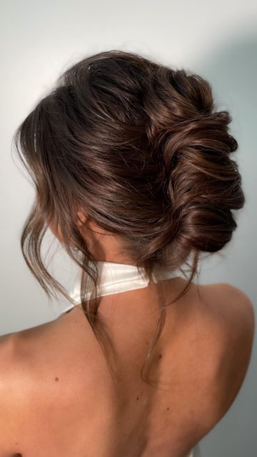 a chic French twist updo with a voluminous top and waves down is a beautiful and catchy idea for a bridesmaid or even bride
