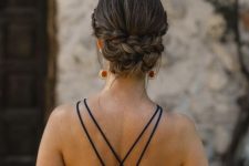 a chic and cool braided low updo with a volume on top is a cool and pretty solution for a wedding guest or bridesmaid